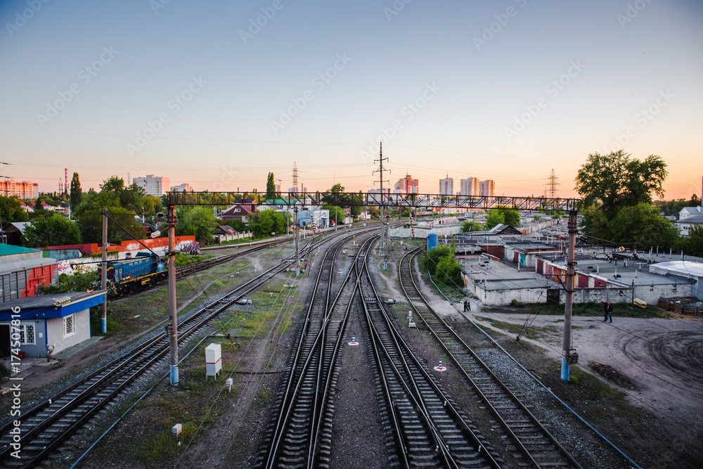 Railroad at sunset. Railway station, Industrial logistic and transportation concept background