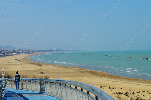 Spring sea view with walking man