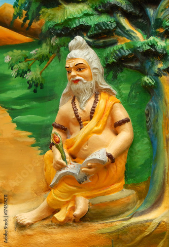 Wall art of an Indian Hindu mythological character Valmiki writing epic ramayana in a temple