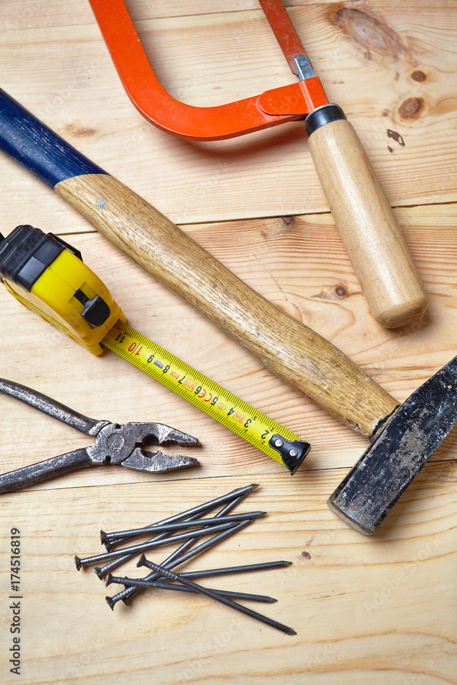set of tools on the wood background set of tools on the wood background