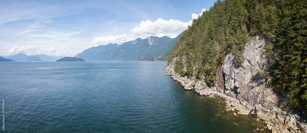 Aerial panorama of a rocky coast during a vibrant sunny summer day. Taken in Horseshoe Bay, West Vancouver, British Columbia, Canada.
