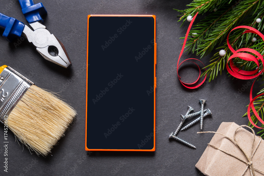 Constructor tools and smart phone, Christmas concept Constructor tools and smart phone, Christmas concept