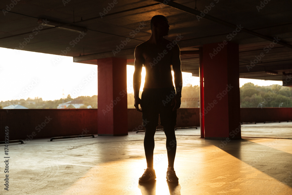 Full length portrait of a half naked afro american sportsman Full length portrait of a half naked afro american sportsman