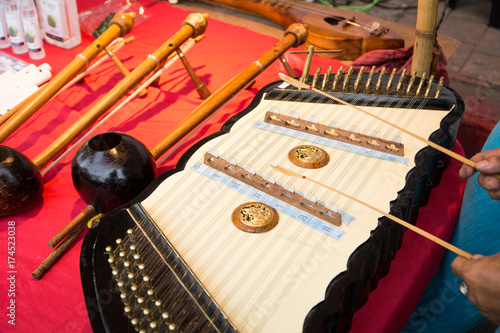 Musician playing the dulcimer photo