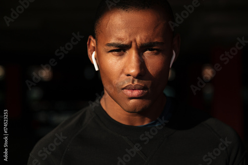 Close up portrait of a handsome young african man looking away
