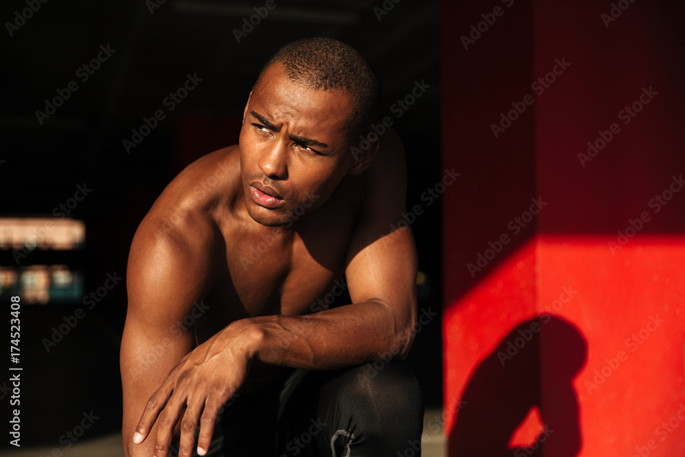 Close up portrait of a muscular half naked african sportsman Close up portrait of a muscular half naked african sportsman