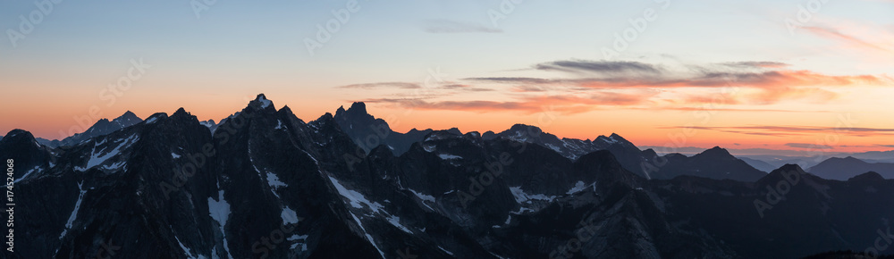 Beautiful high quality panoramic landscape of a mountain range during a vibrant and colorful sunset. Taken near Chilliwack, East of Vancouver, British Columbia, Canada.