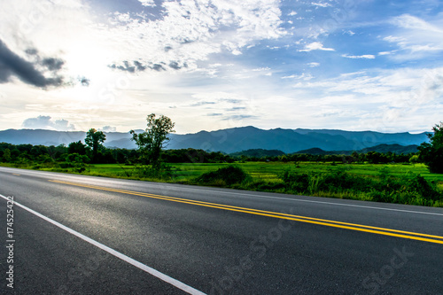 Sunsets after rain on the road.Let's go travel,Summer driving Travel road car mountains view.