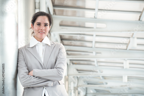 Wallpaper Mural Business woman in suit look to future on building background in city outdoor Torontodigital.ca