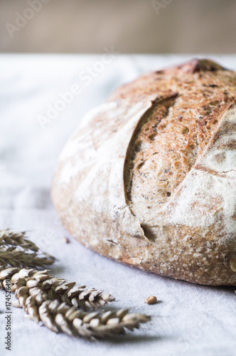 Close-up of Whole Wheat Sourdough Bread on a gray kitchen towel