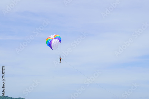 The sky parachute has a blue backdrop background.