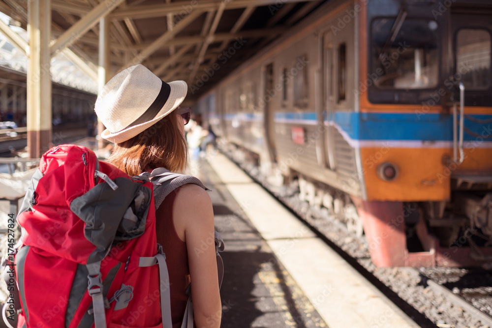 Travelers are waiting for their train. Outdoor adventure travel by train concept.