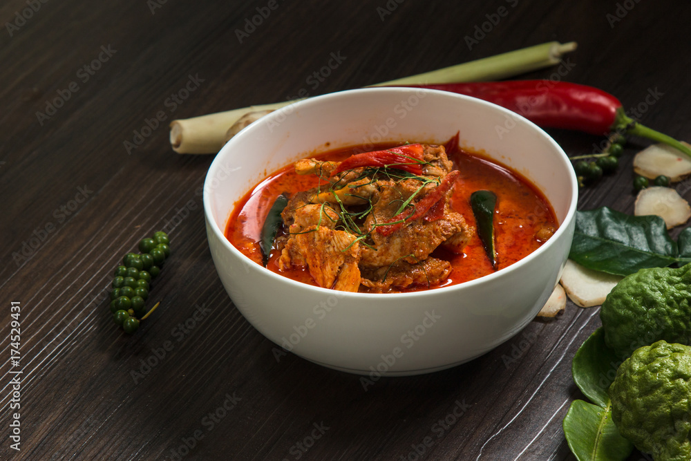 Chicken curry with different spices on dark background, Delicius chicken panang curry, thai food, selected focus. Chicken curry with different spices on dark background, Delicius chicken panang curry, thai food, selected focus.