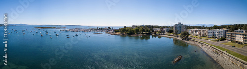 Fototapeta Naklejka Na Ścianę i Meble -  Aerial panoramic landscape view of a beautiful rocky shore on Pacific Coast. Taken in Victoria, Vancouver Island, British Columbia, Canada.