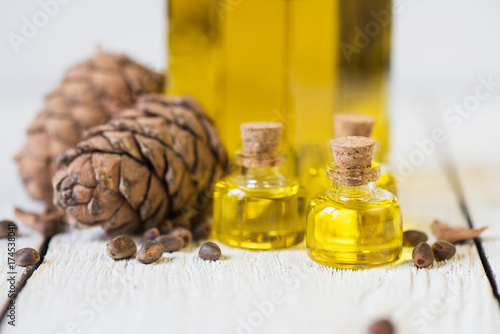 Oil of cedar nuts on a whit...