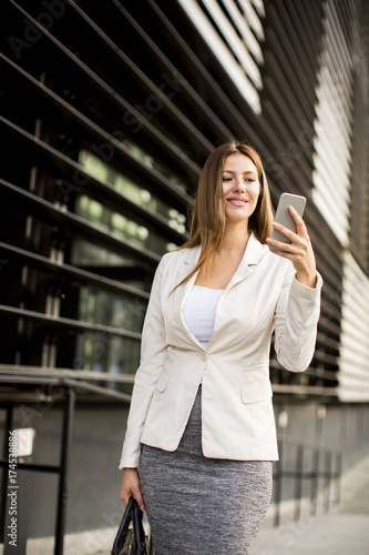 Businesswoman using mobile ...