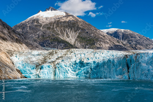 Wide angle view of an Alaskan glacier with blue ice