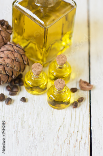 Oil of cedar nuts on a whit...