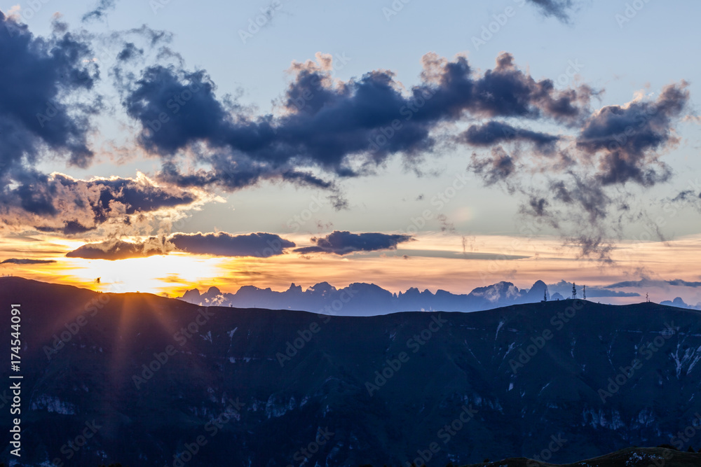 Panorama of sun shining alongside dolomitic peaks, Veneto, Italy