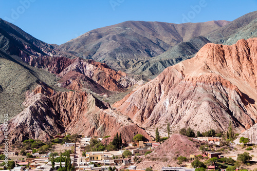 Purmamarca, hills of several colors among which predominates red, violet, purple, pink, orange, brown photo