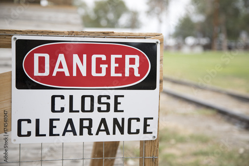 Danger Close Clearance sign close to a railway track