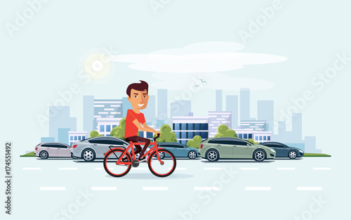 Man on Bicycle on the street with City Skyline Background