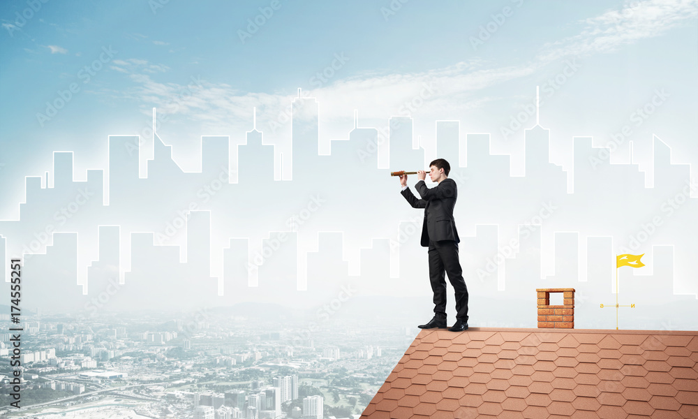 Engineer man standing on roof and looking in spyglass. Mixed media Engineer man standing on roof and looking in spyglass. Mixed media