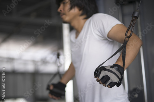 man exercising in fitness gym for good health.