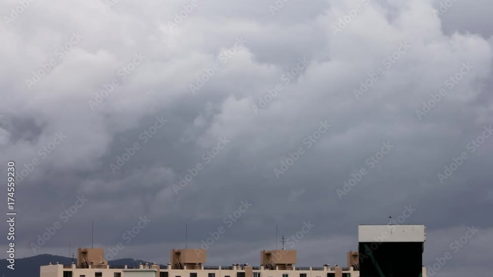 Slow moving clouds over the building in a rain Slow moving clouds over the building in a rain