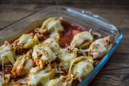 Conchiglioni with meat and cheese in tomato sauce