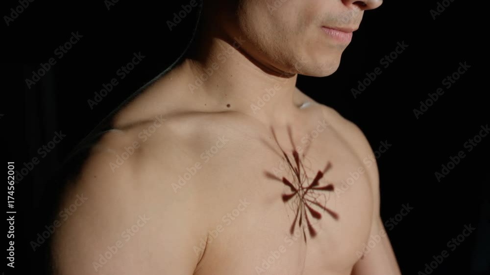 Graphic animation projected onto the chest of male model given injection Graphic animation projected onto the chest of male model given injection