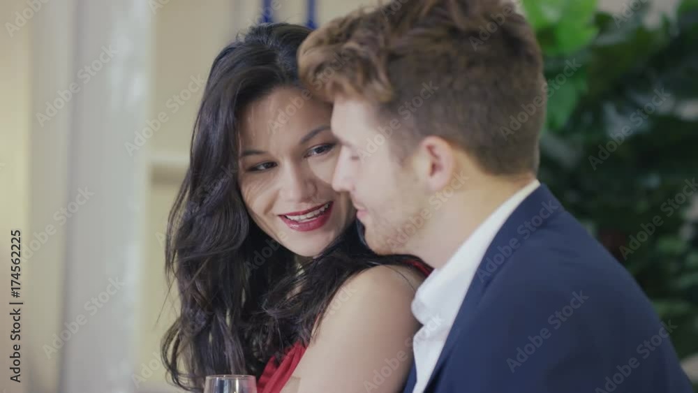 Close up portrait young couple in love, drinking champagne & chatting Close up portrait young couple in love, drinking champagne & chatting