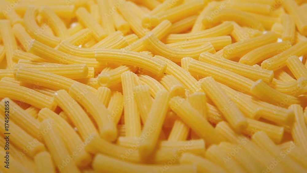 Rotating pasta (small size, ruled shape). Close-up front shot.
Rotating pasta (small size, ruled shape). Close-up front shot.