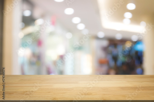 Wallpaper Mural empty wooden table top with blurred with bokeh light of shopping mall background, used for display or montage your product Torontodigital.ca