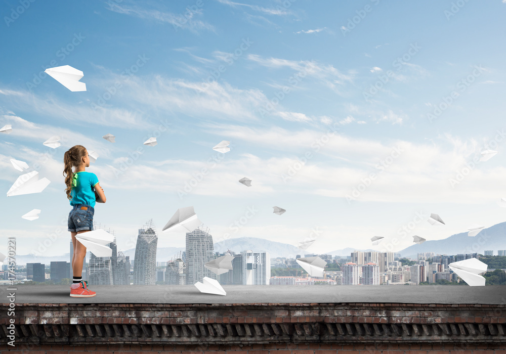 Fototapeta premium Concept of careless happy childhood with girl looking far away