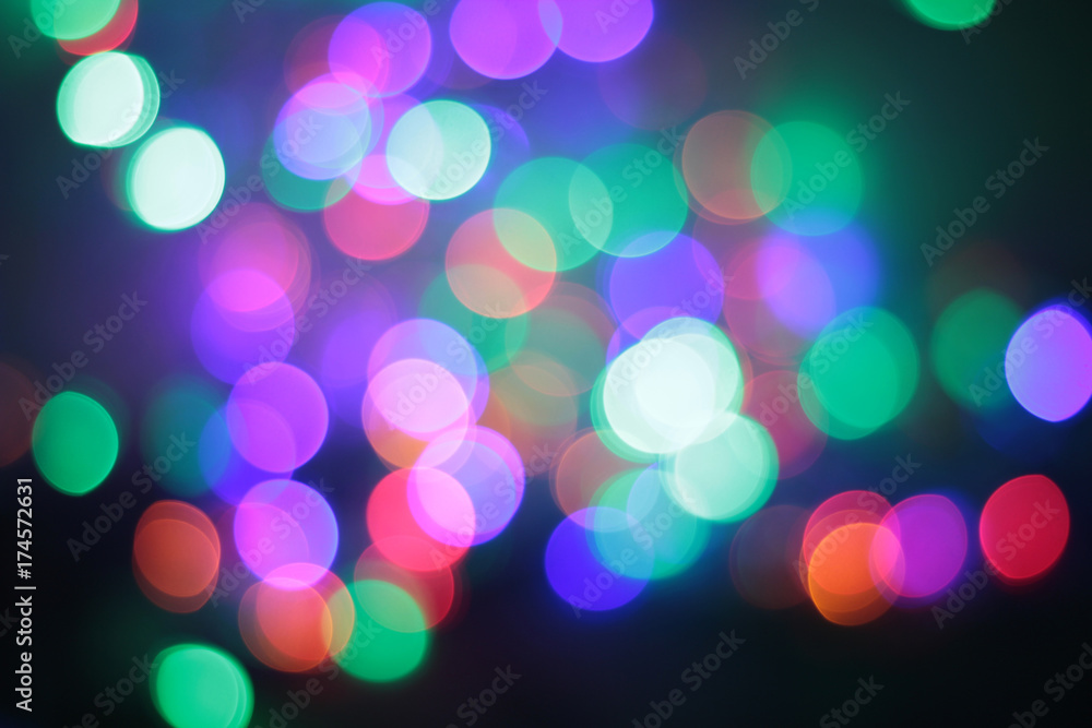 Coloured bokeh on the black background, defocused background. Coloured bokeh on the black background, defocused background.
