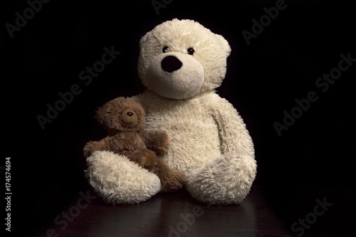 baby toy teddy bears on a black background © EvgenyPyatkov