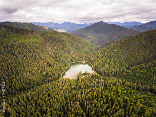 Aerial view of Lake Synevir in Carpathian Mountains in Ukraine photo