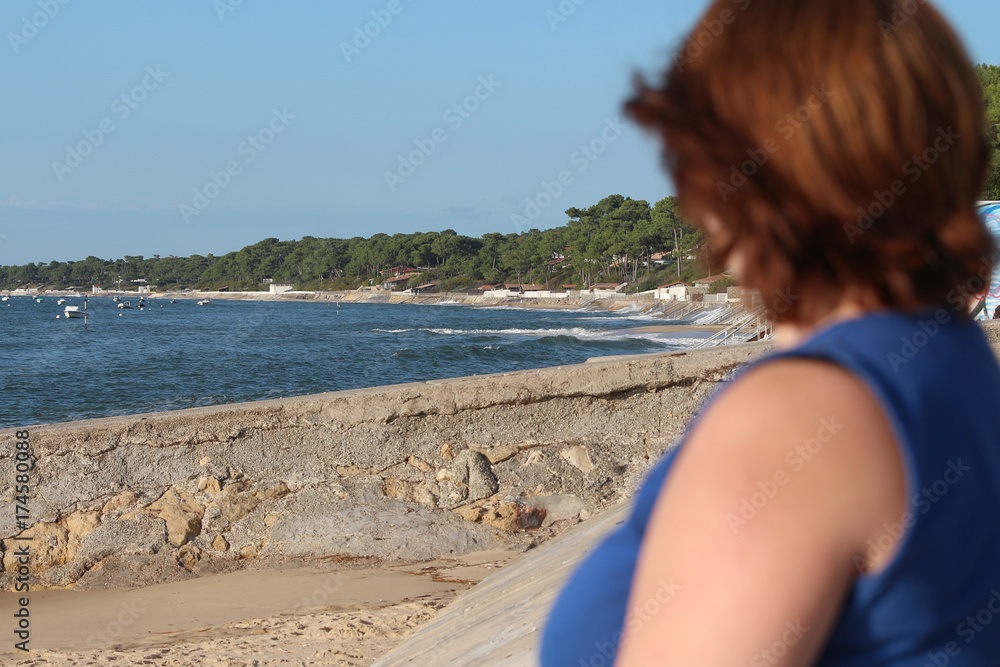 woman looking at the landscape in the bassin d'Arcachon woman looking at the landscape in the bassin d'Arcachon