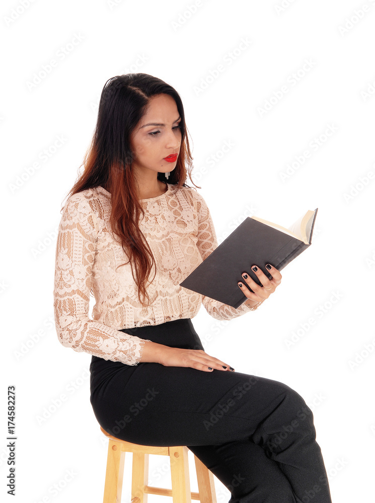 Pretty woman sitting and reading Pretty woman sitting and reading