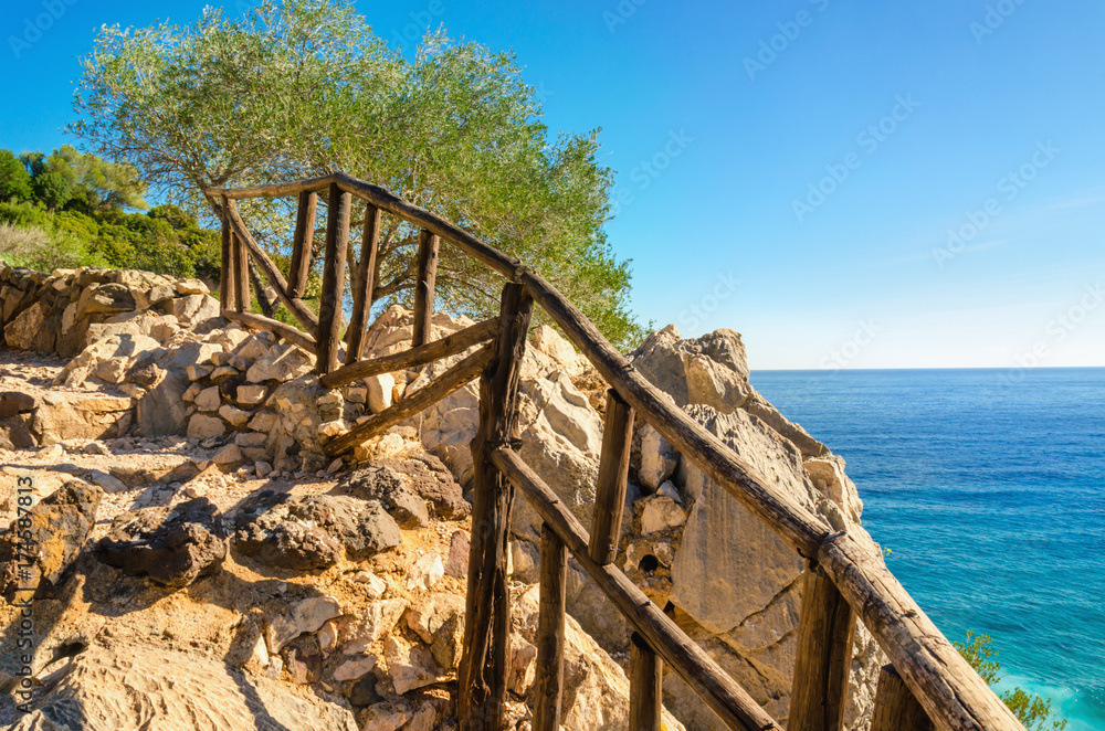 Wooden walk path to Sardinia beach , Golfo di Orosei, Italy Wooden walk path to Sardinia beach , Golfo di Orosei, Italy