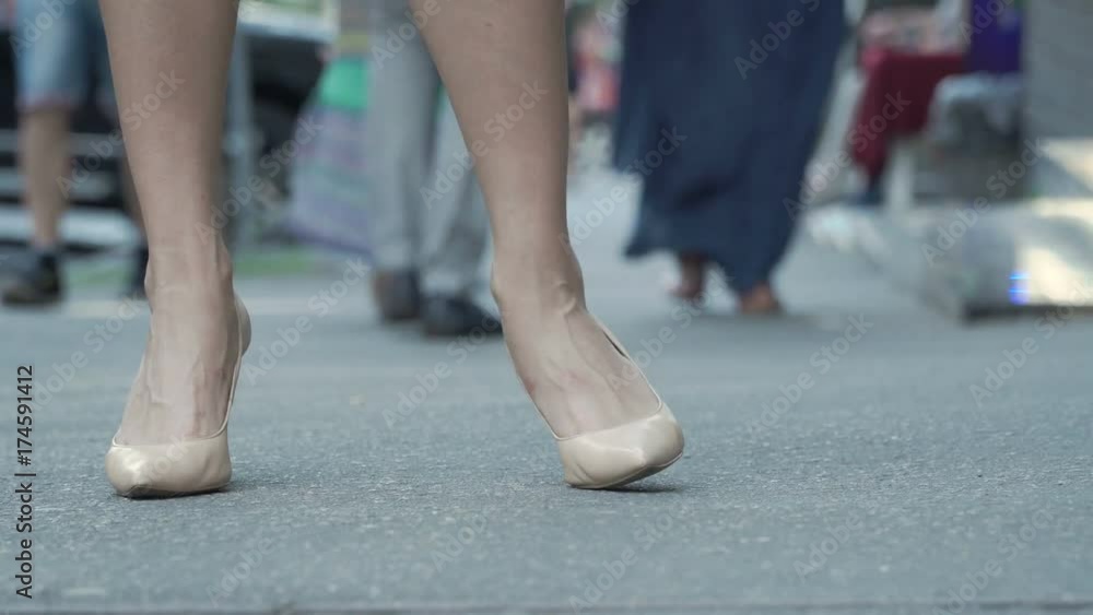 Female shoes on high heels at the street Female shoes on high heels at the street