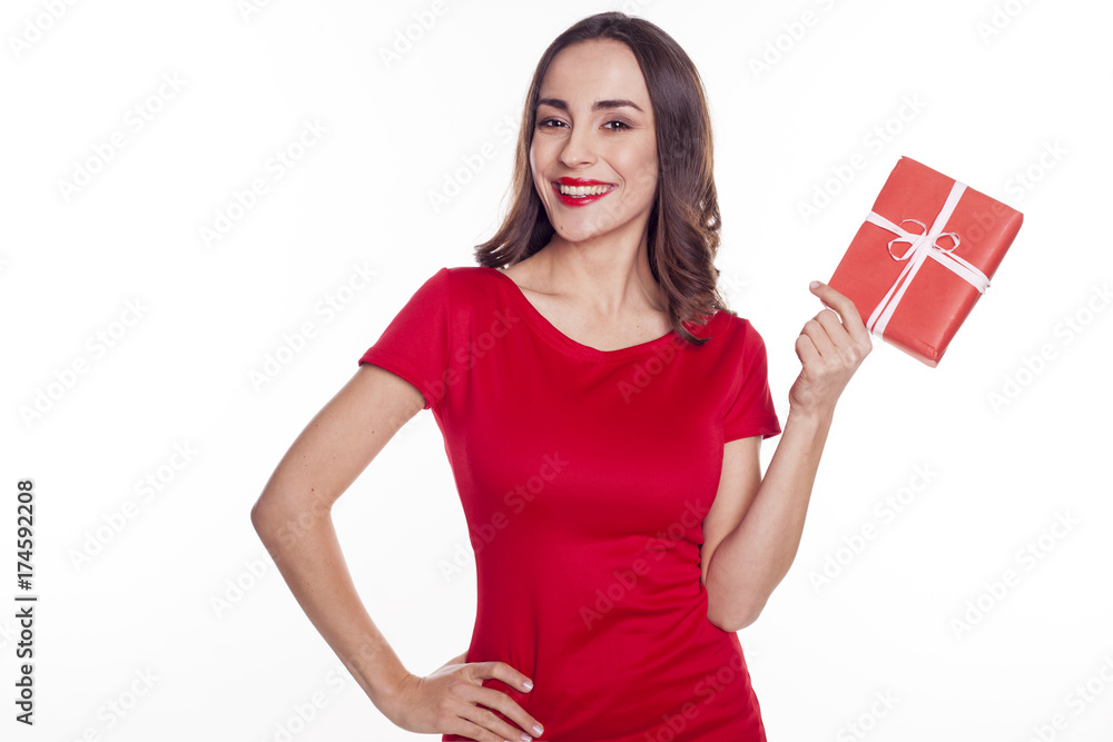 A gift from a loved one. Beautiful smiling young brunette girl with Gift box for man A gift from a loved one. Beautiful smiling young brunette girl with Gift box for man