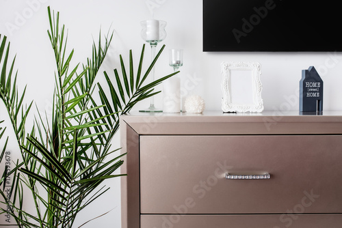 Tv stand and plant decor on modern bedroom design