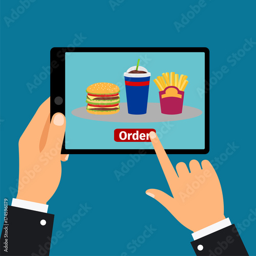 Hand holding tablet, order fast food