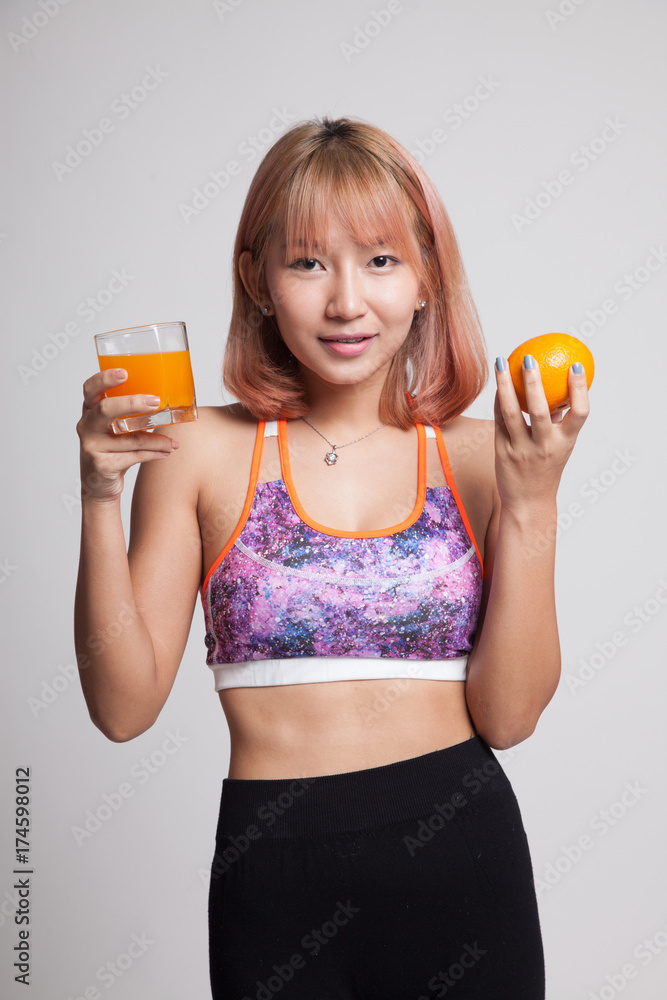 Beautiful Asian healthy girl with orange juice and orange fruit. Beautiful Asian healthy girl with orange juice and orange fruit.