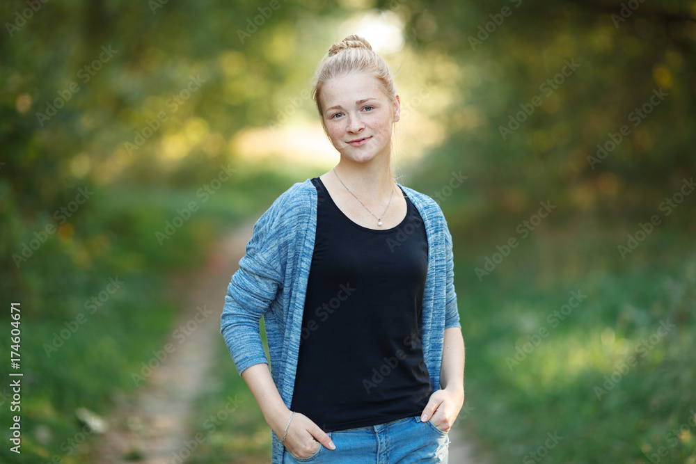 Outdoors lifestyle portrait of young adorable fresh looking redhead woman with freckles gorgeous extra long hair. Emotion and facial expression concept. Outdoors lifestyle portrait of young adorable fresh looking redhead woman with freckles gorgeous extra long hair. Emotion and facial expression concept.