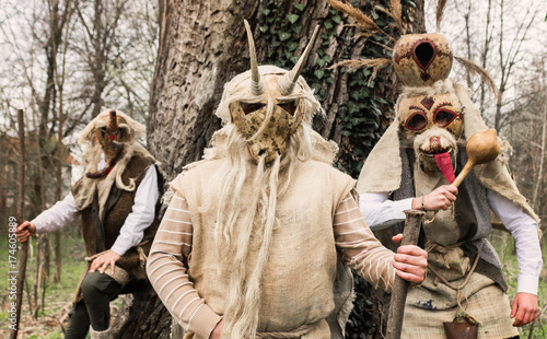 Young peolpe during old slavic festival dressed like forest spirits  