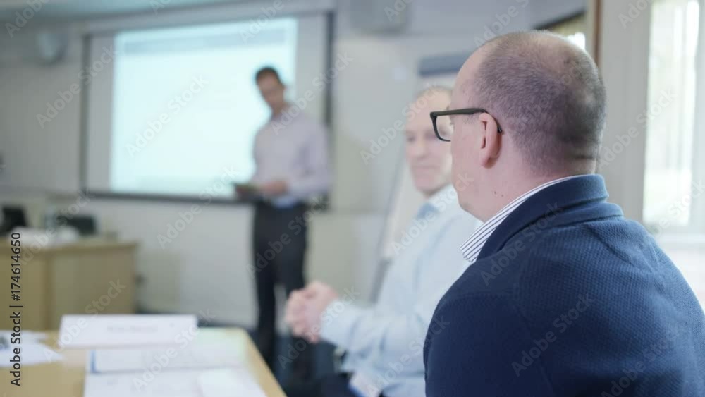 Real group at business seminar discussing issues & sharing information Real group at business seminar discussing issues & sharing information
