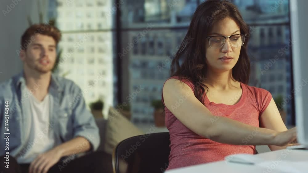 Affectionate couple at home, woman working on PC comes to relax with partner Affectionate couple at home, woman working on PC comes to relax with partner
